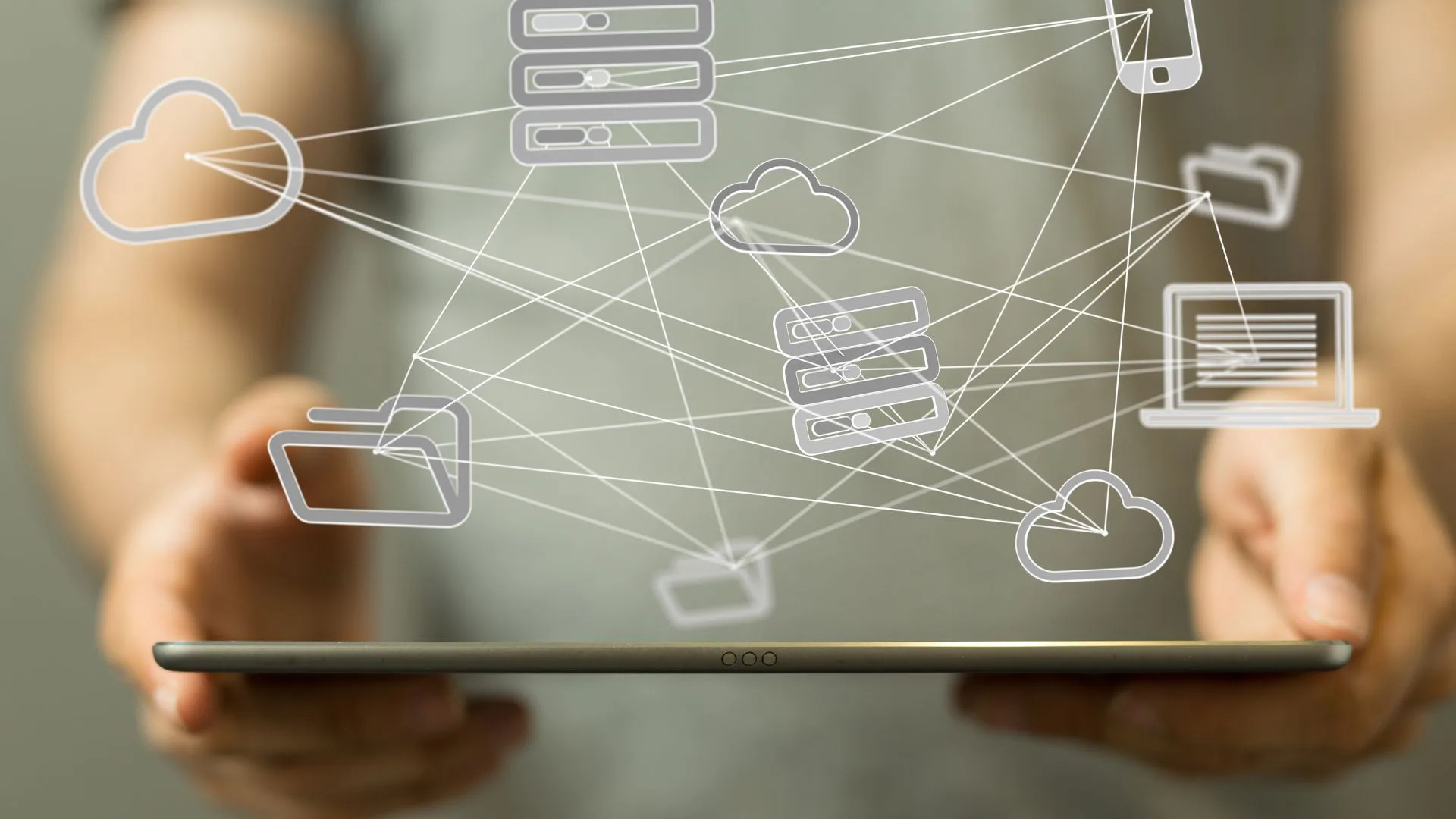 Person holding a digital tablet with cloud and network graphics illustrating communications, digital tools and industry resources for healthcare communications professionals.